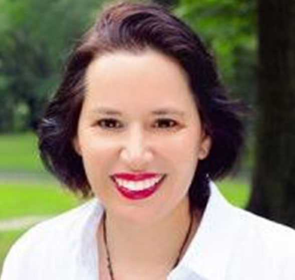 A woman with red lipstick is smiling for the camera.